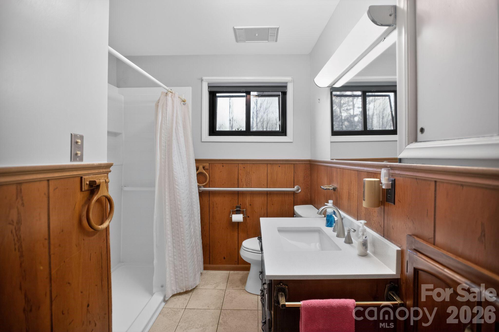 4783 Calico Road Lenoir, NC 28645 - Photo 22 of 44 a bathroom with a sink and a mirror