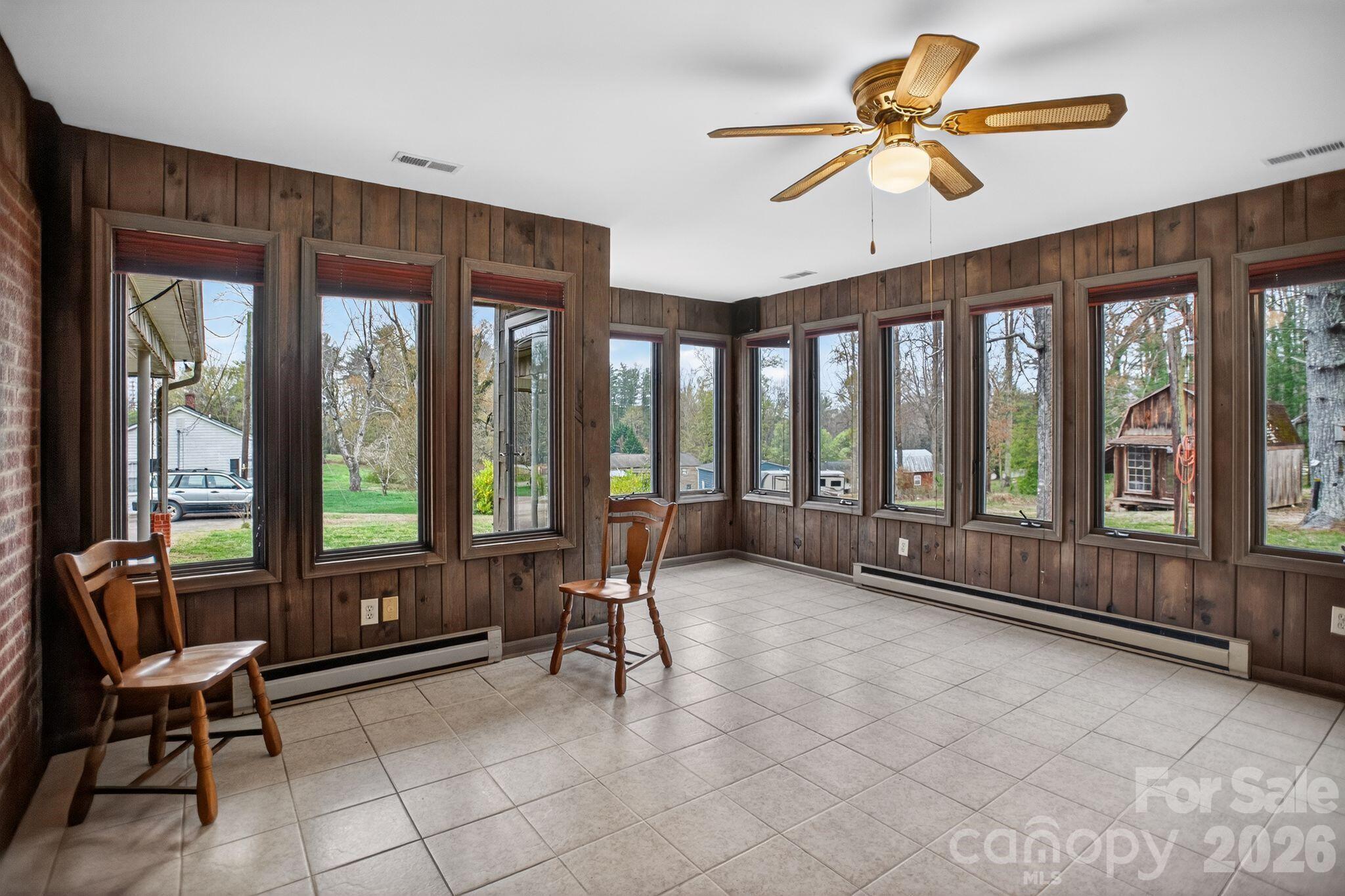 4783 Calico Road Lenoir, NC 28645 - Photo 24 of 44 a living room with furniture and large windows