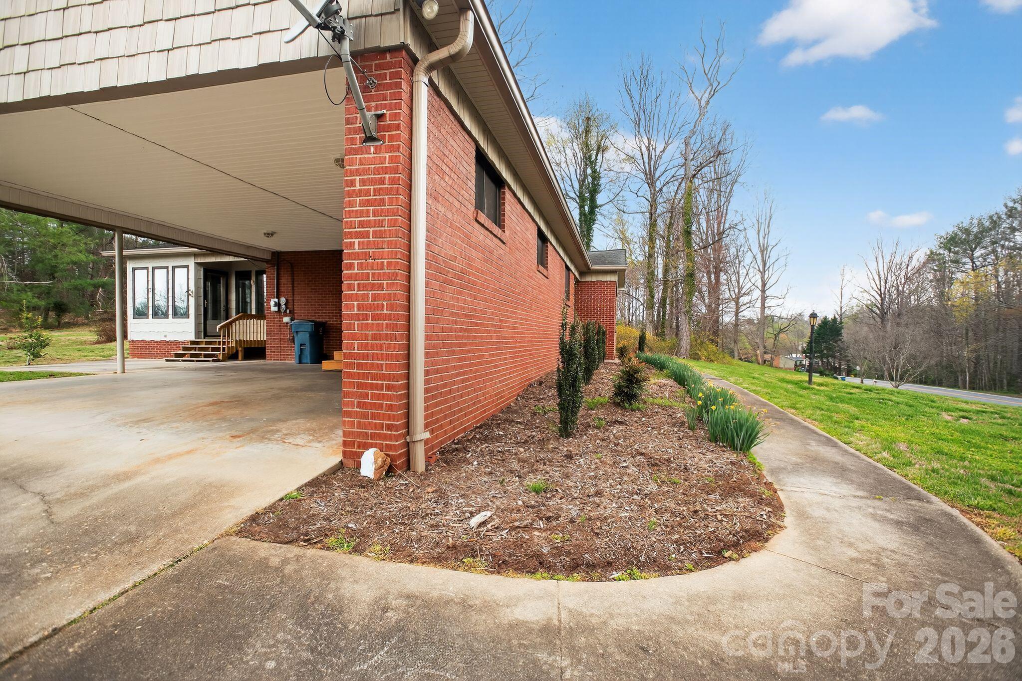 4783 Calico Road Lenoir, NC 28645 - Photo 32 of 44 a view of a house with a yard