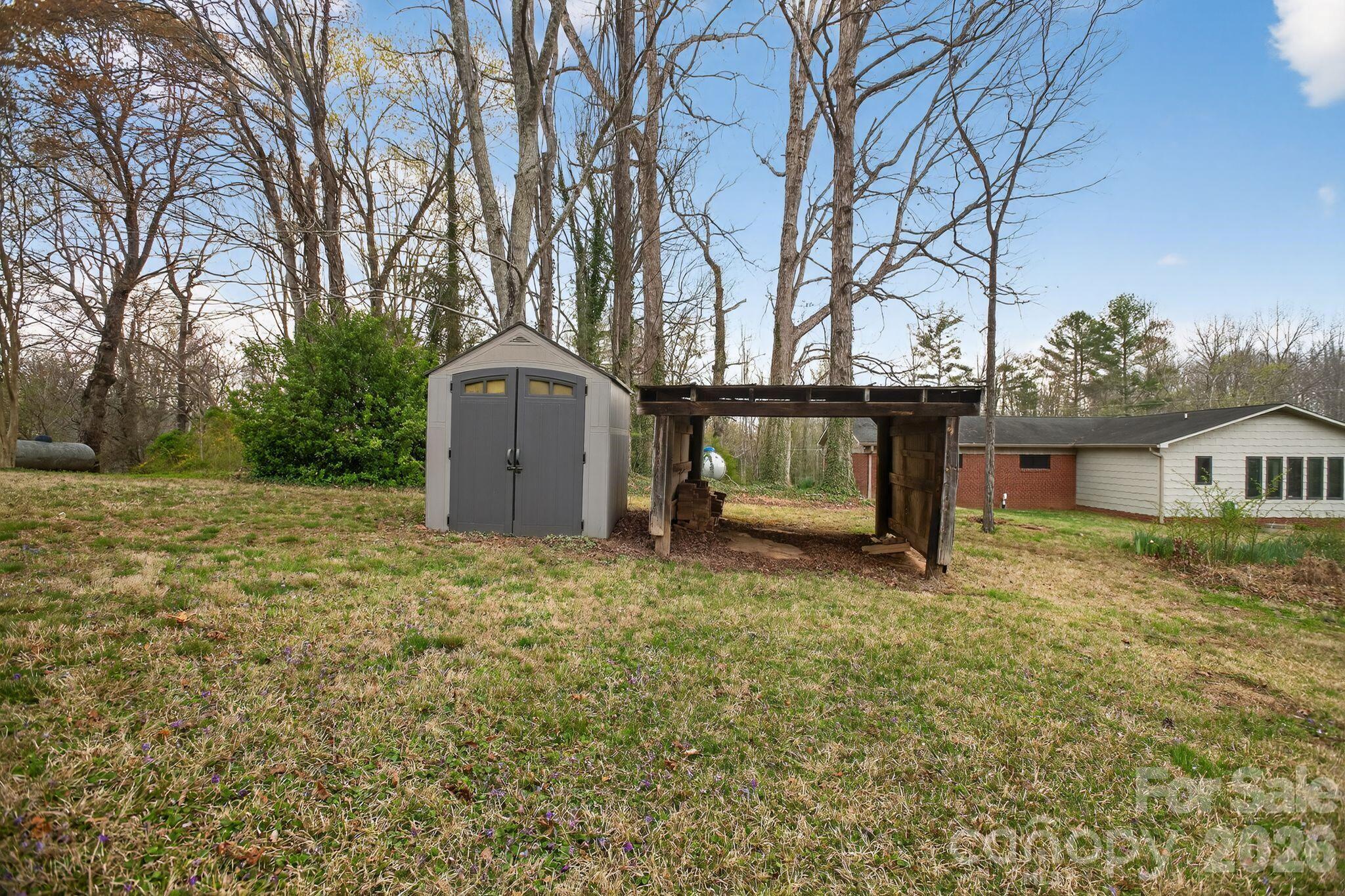 4783 Calico Road Lenoir, NC 28645 - Photo 38 of 44 a view of a house with a yard