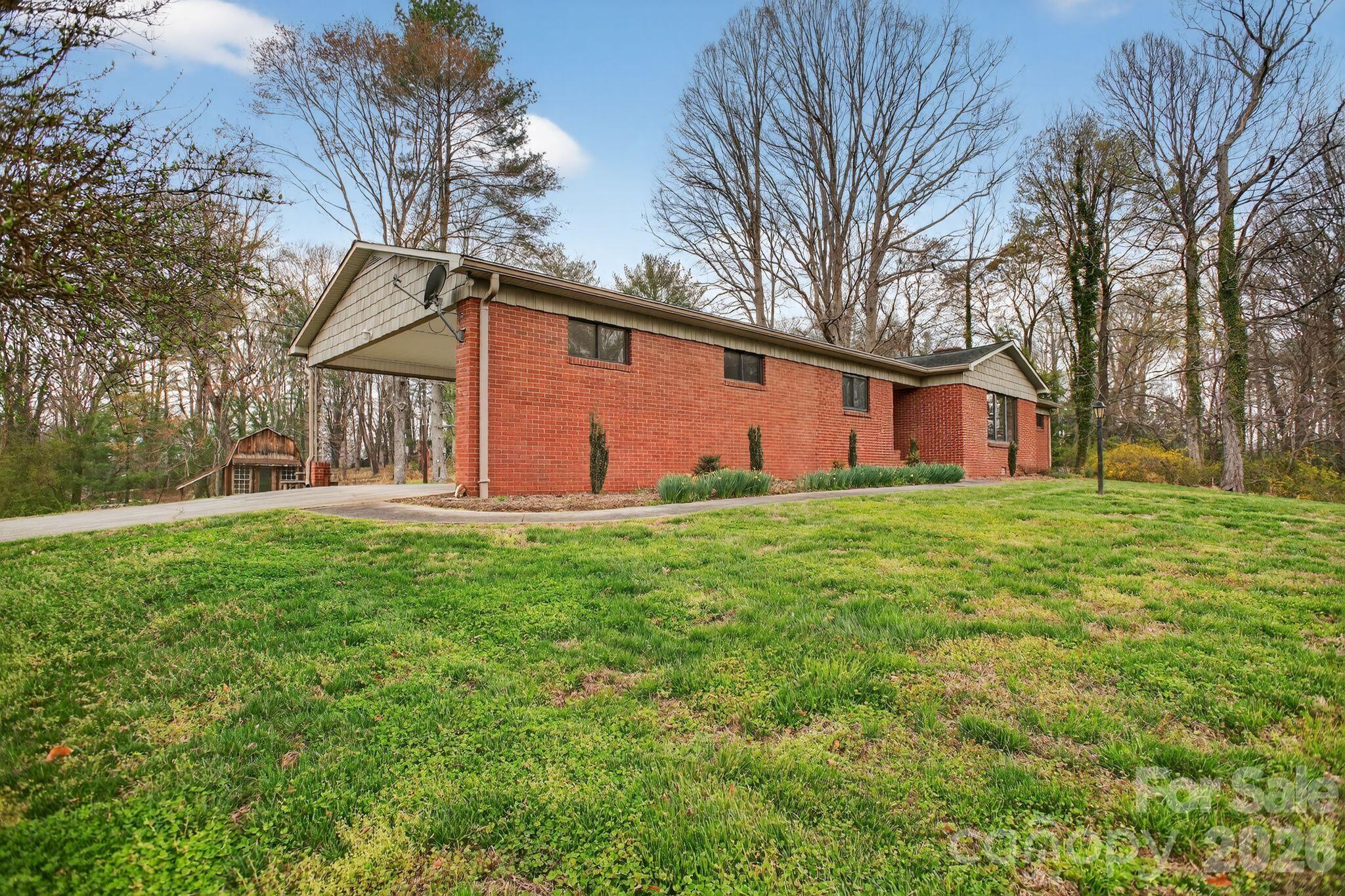 4783 Calico Road Lenoir, NC 28645 - Photo 6 of 44 a front view of house with yard and green space