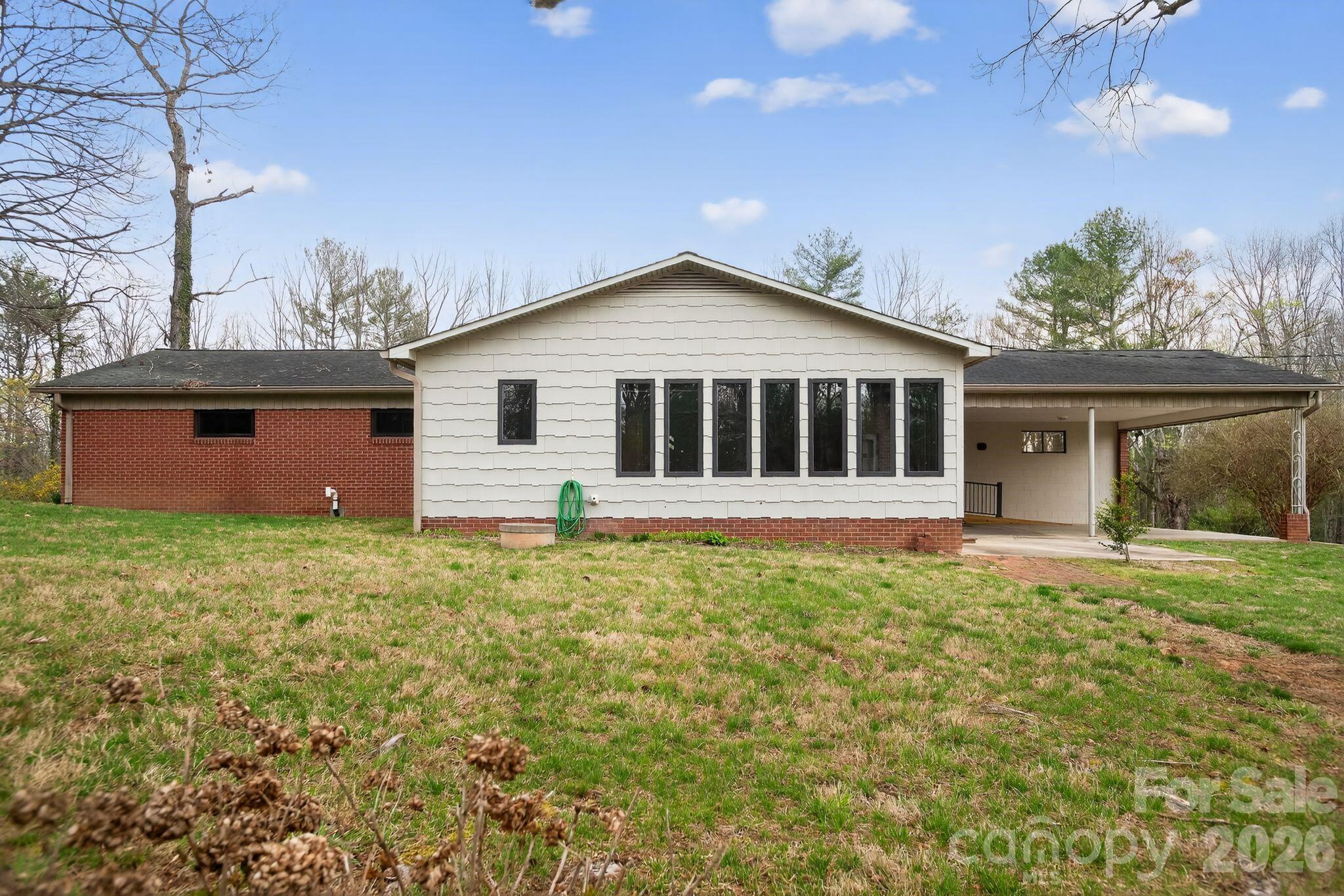 4783 Calico Road Lenoir, NC 28645 - Photo 7 of 44 front view of a house with a yard