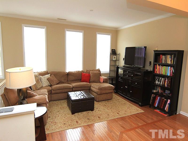 6907 Middleboro Drive Raleigh, NC 27612 - Photo 3 of 15 a living room with furniture and a flat screen tv