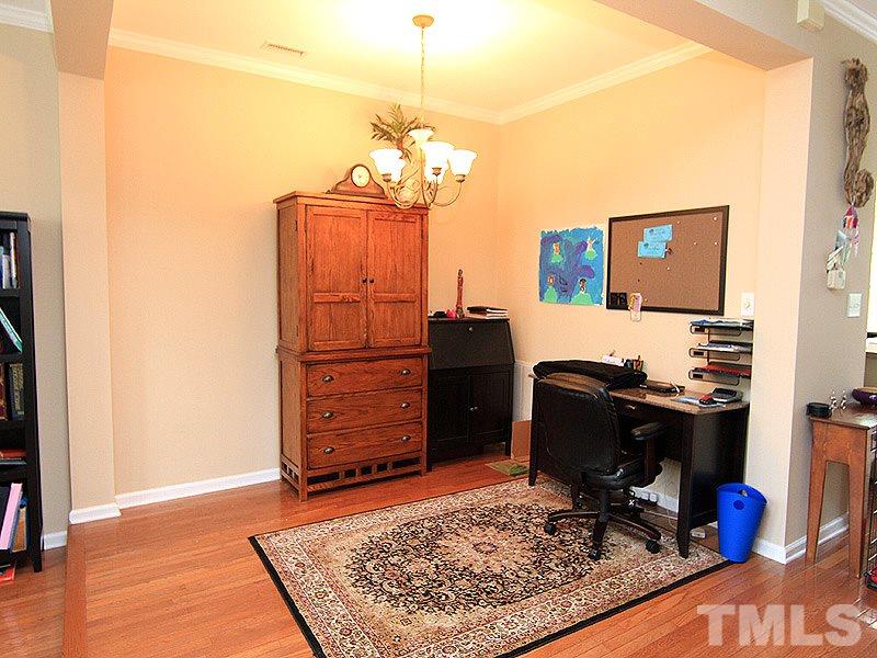 6907 Middleboro Drive Raleigh, NC 27612 - Photo 4 of 15 a view of a workspace with furniture