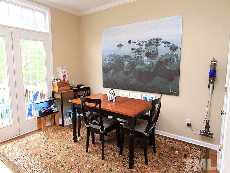 6907 Middleboro Drive Raleigh, NC 27612 - Photo 6 of 15 a dining room with furniture and wooden floor