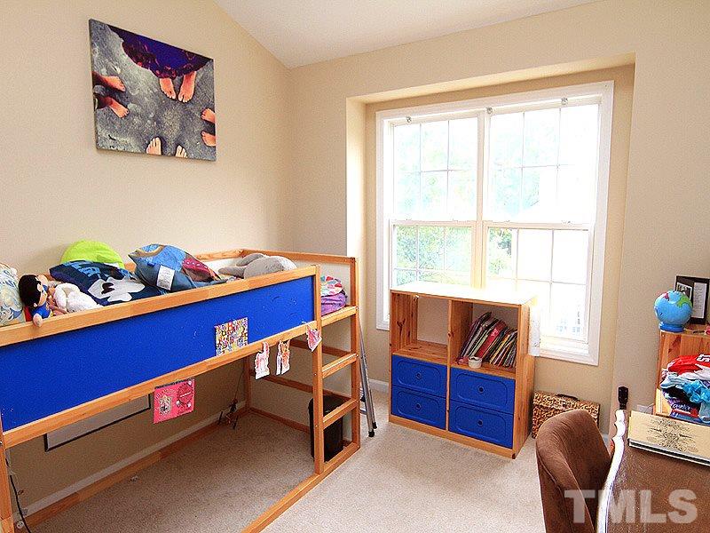 6907 Middleboro Drive Raleigh, NC 27612 - Photo 10 of 15 a room with furniture and window