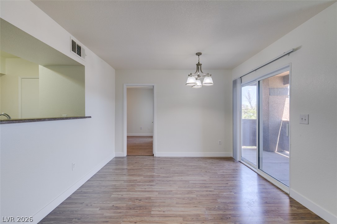 6650 West Warm Springs Road, Unit 2118 Las Vegas, NV 89118 - Photo 6 of 41 A well-lit room offers seamless access to outdoor living through sliding glass doors.