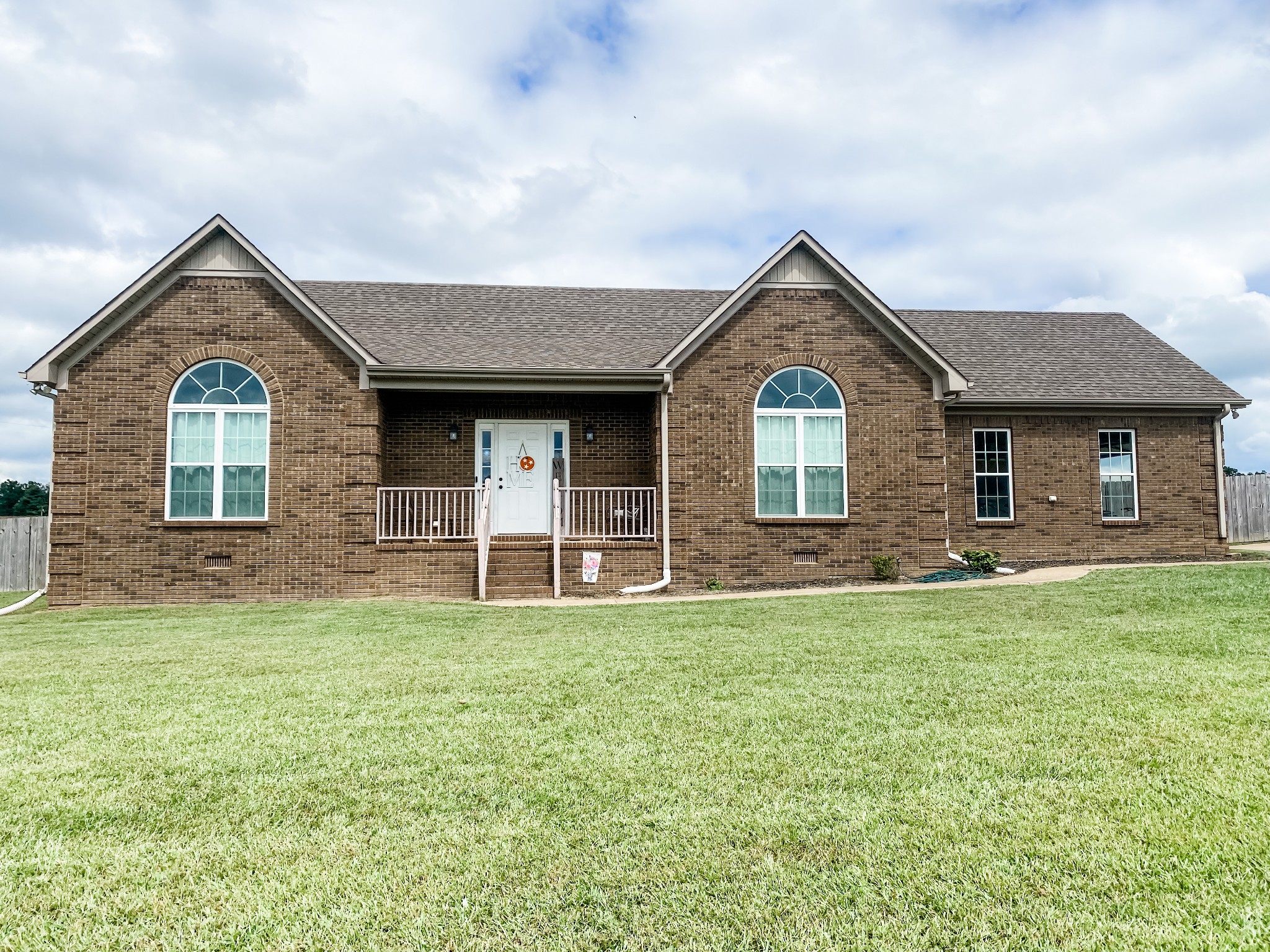 169 Camargo Road Fayetteville, TN 37334 - Photo 1 of 27 a front view of a house with a yard