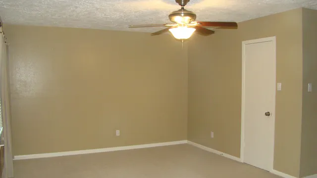 a view of a chandelier fan in a room
