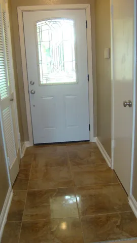 a view of an empty room and window