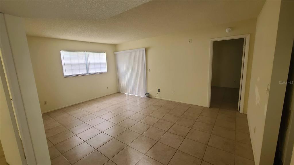 454 Fairways Circle, Unit B102 Ocala, FL 34472 - Photo 2 of 7 a view of an empty room and window