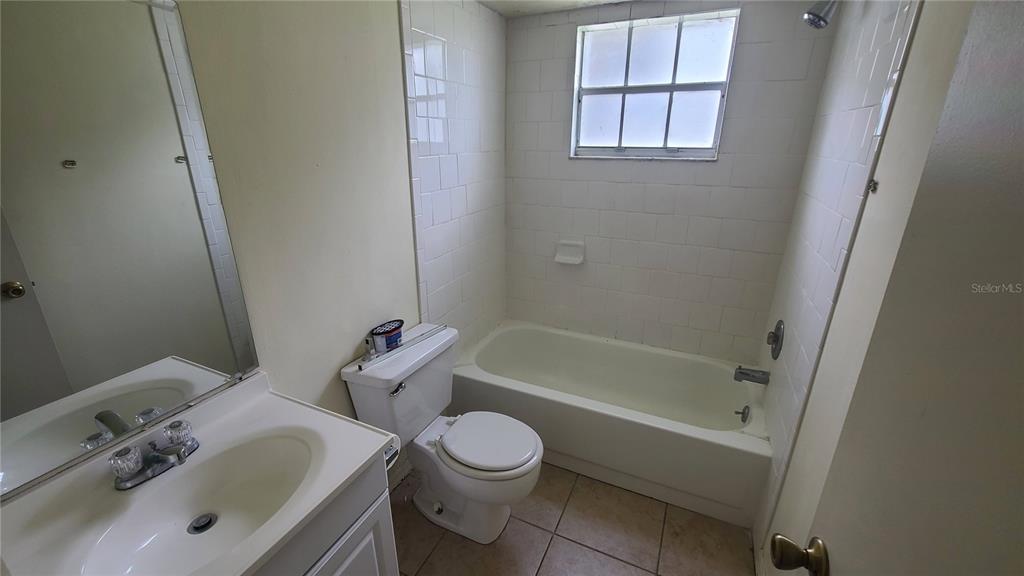 454 Fairways Circle, Unit B102 Ocala, FL 34472 - Photo 3 of 7 a bathroom with a sink toilet vanity and bathtub