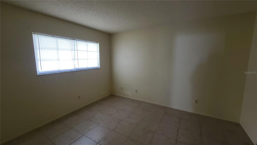 454 Fairways Circle, Unit B102 Ocala, FL 34472 - Photo 6 of 7 an empty room with a window