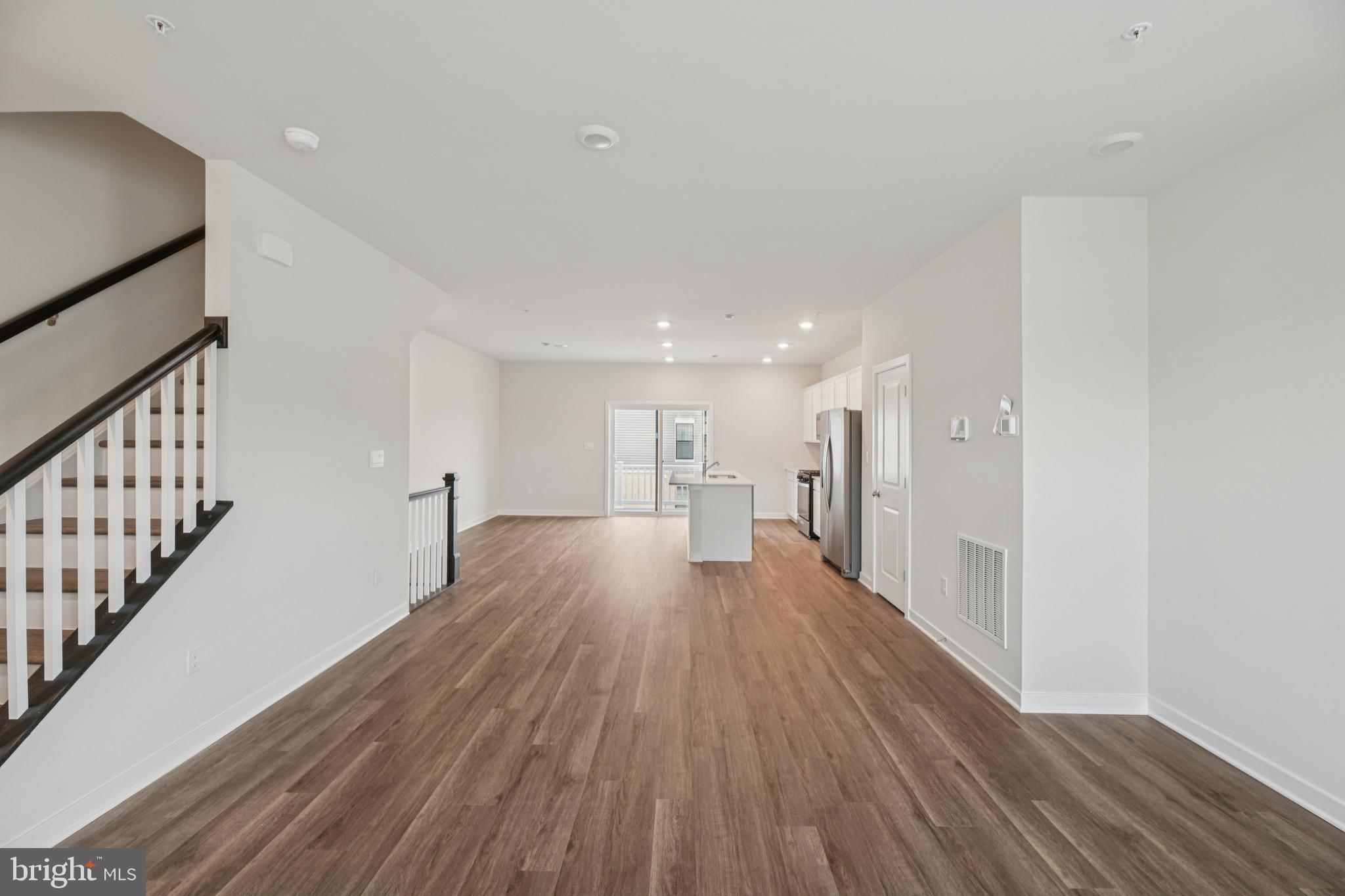 7406 Calm Retreat Boulevard Brandywine, MD 20613 - Photo 19 of 37 a view of a hallway with wooden floor