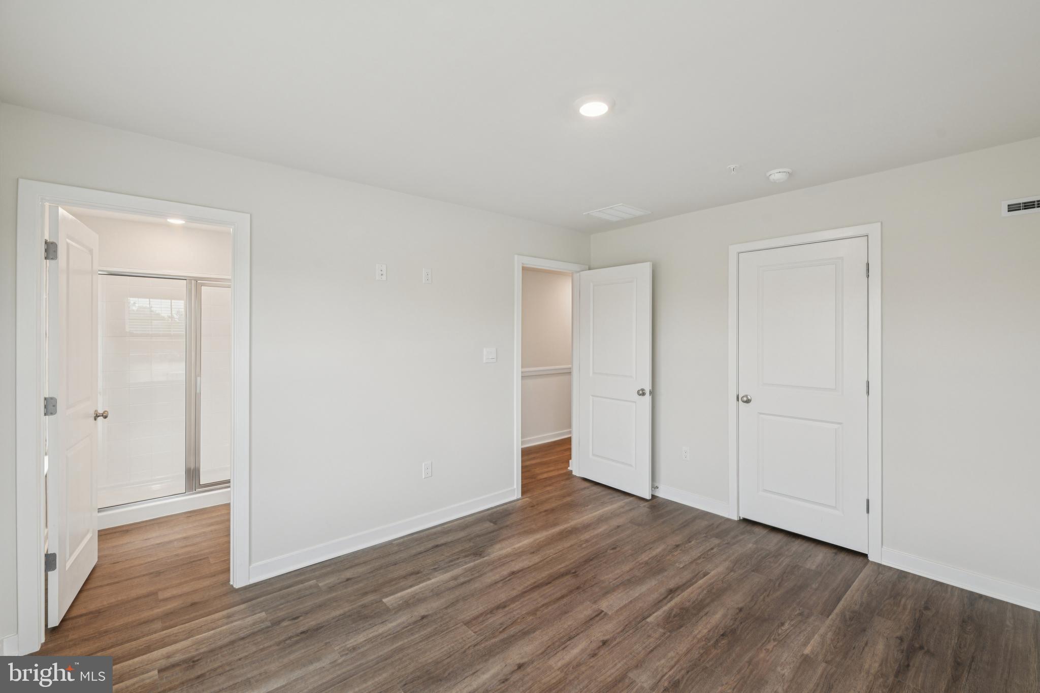 7406 Calm Retreat Boulevard Brandywine, MD 20613 - Photo 25 of 37 a view of an empty room and wooden floor