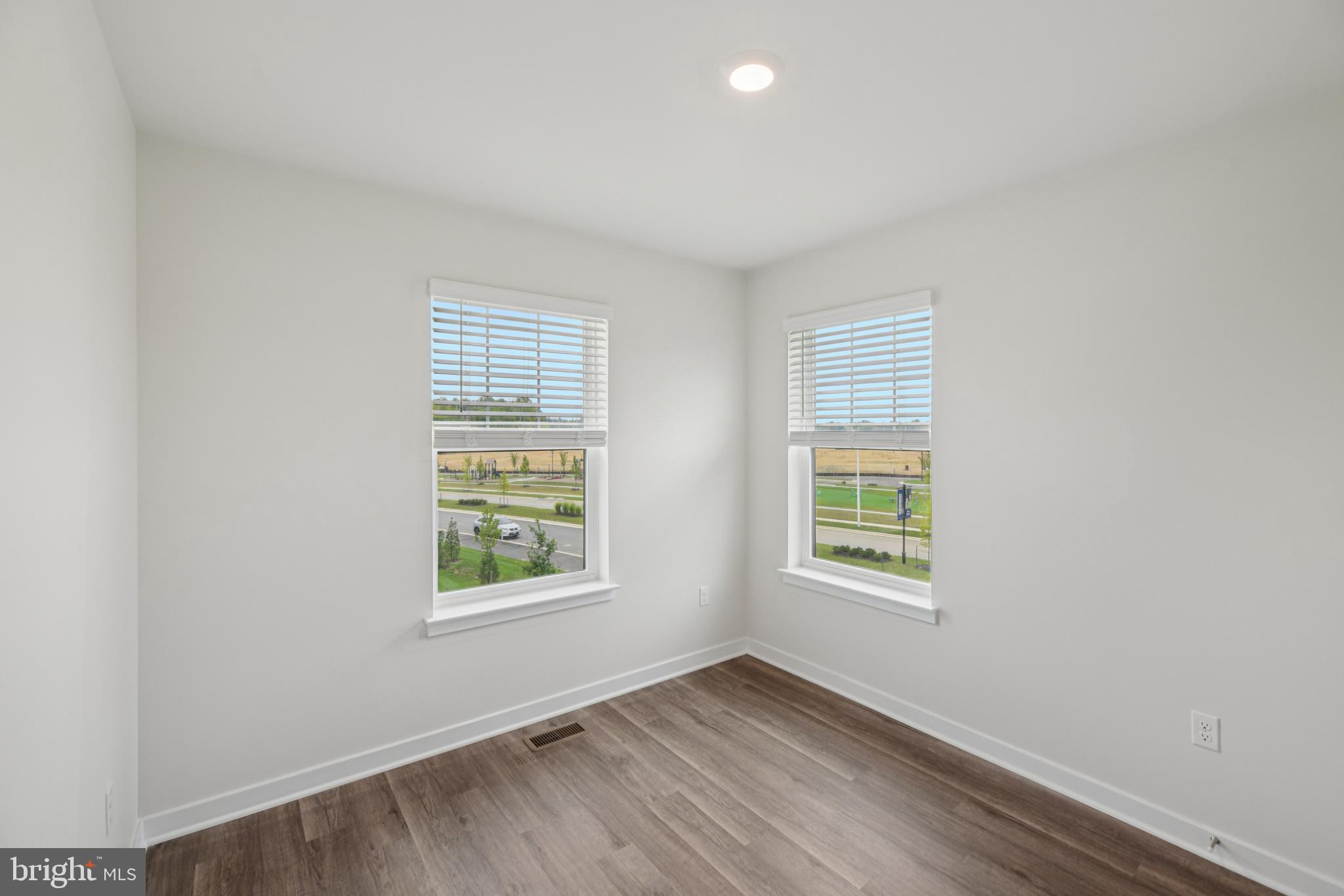 7406 Calm Retreat Boulevard Brandywine, MD 20613 - Photo 32 of 37 an empty room with windows