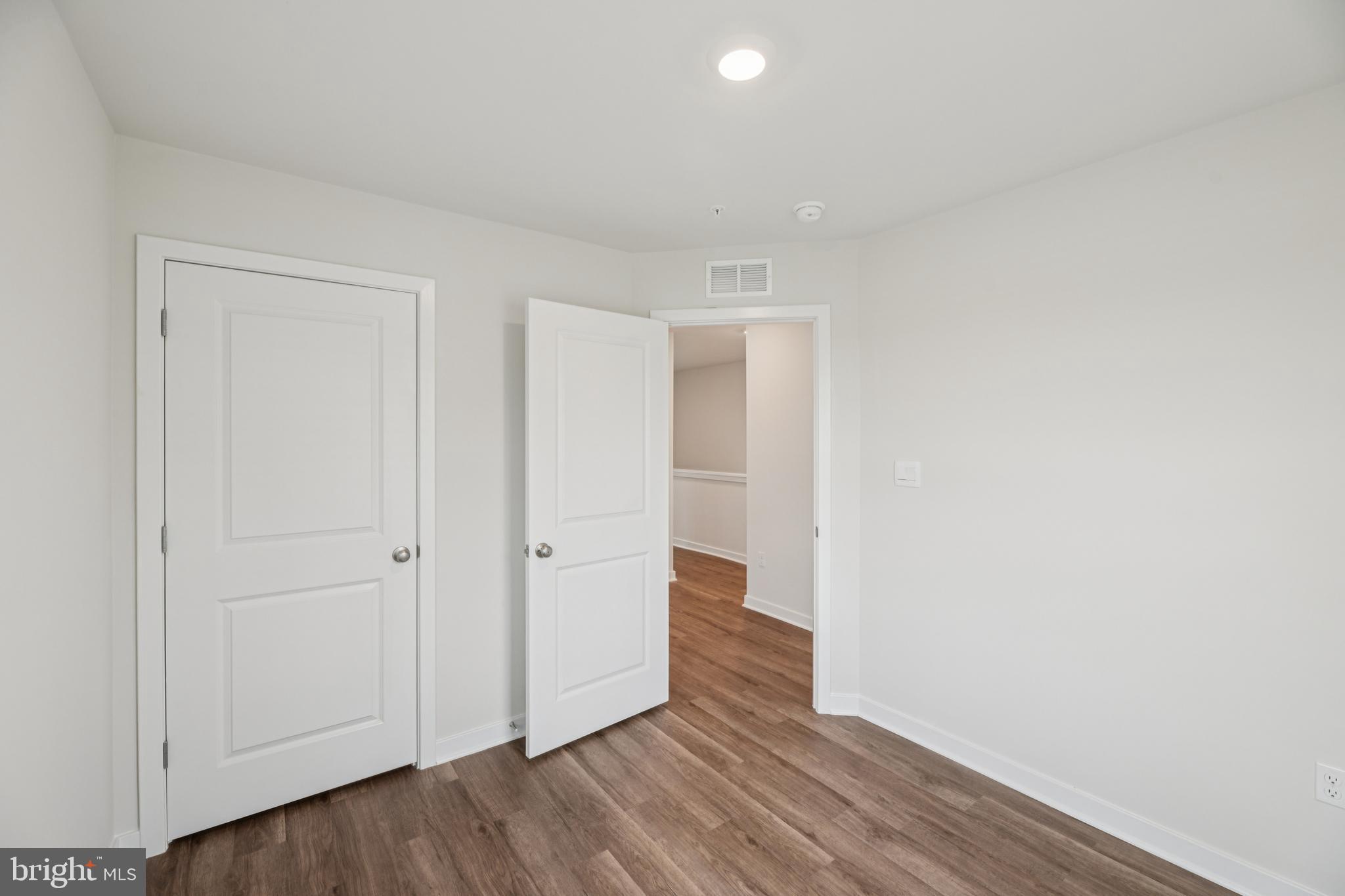 7406 Calm Retreat Boulevard Brandywine, MD 20613 - Photo 33 of 37 a view of hallway with wooden floor