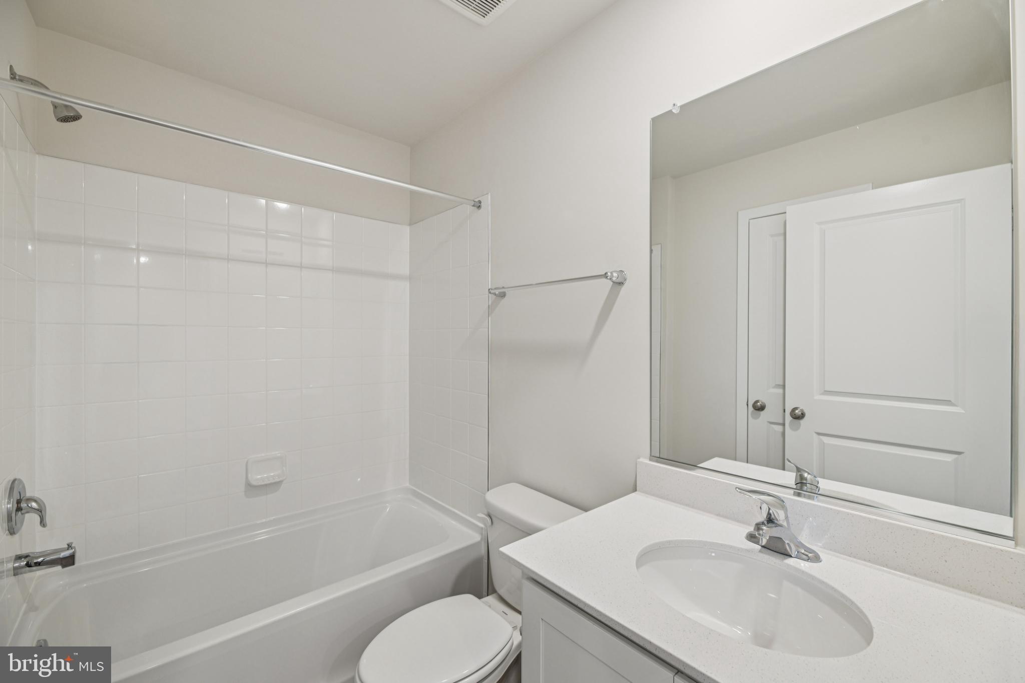 7406 Calm Retreat Boulevard Brandywine, MD 20613 - Photo 35 of 37 a bathroom with a sink toilet and shower