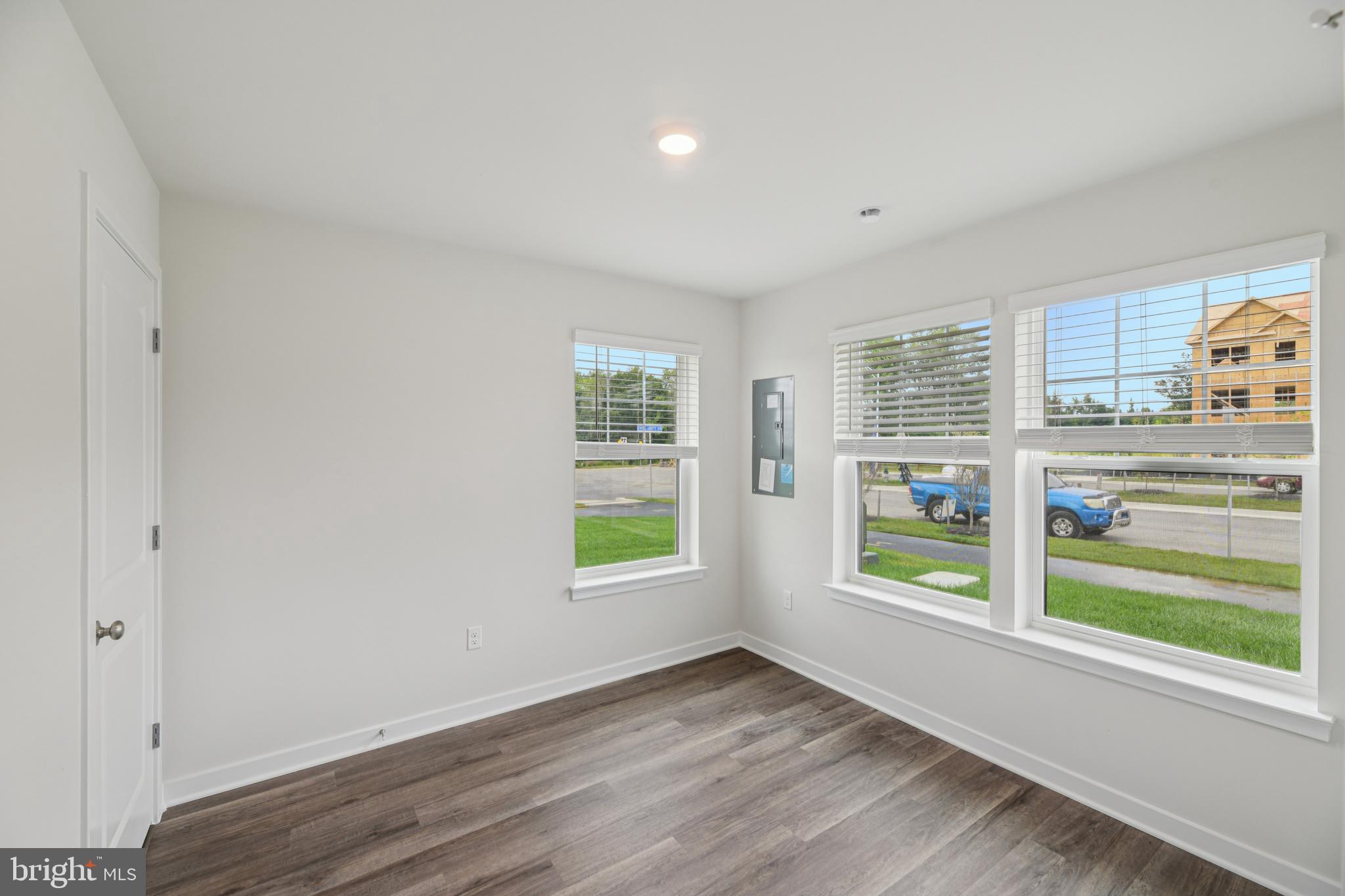 7406 Calm Retreat Boulevard Brandywine, MD 20613 - Photo 5 of 37 wooden floor in an empty room with a window