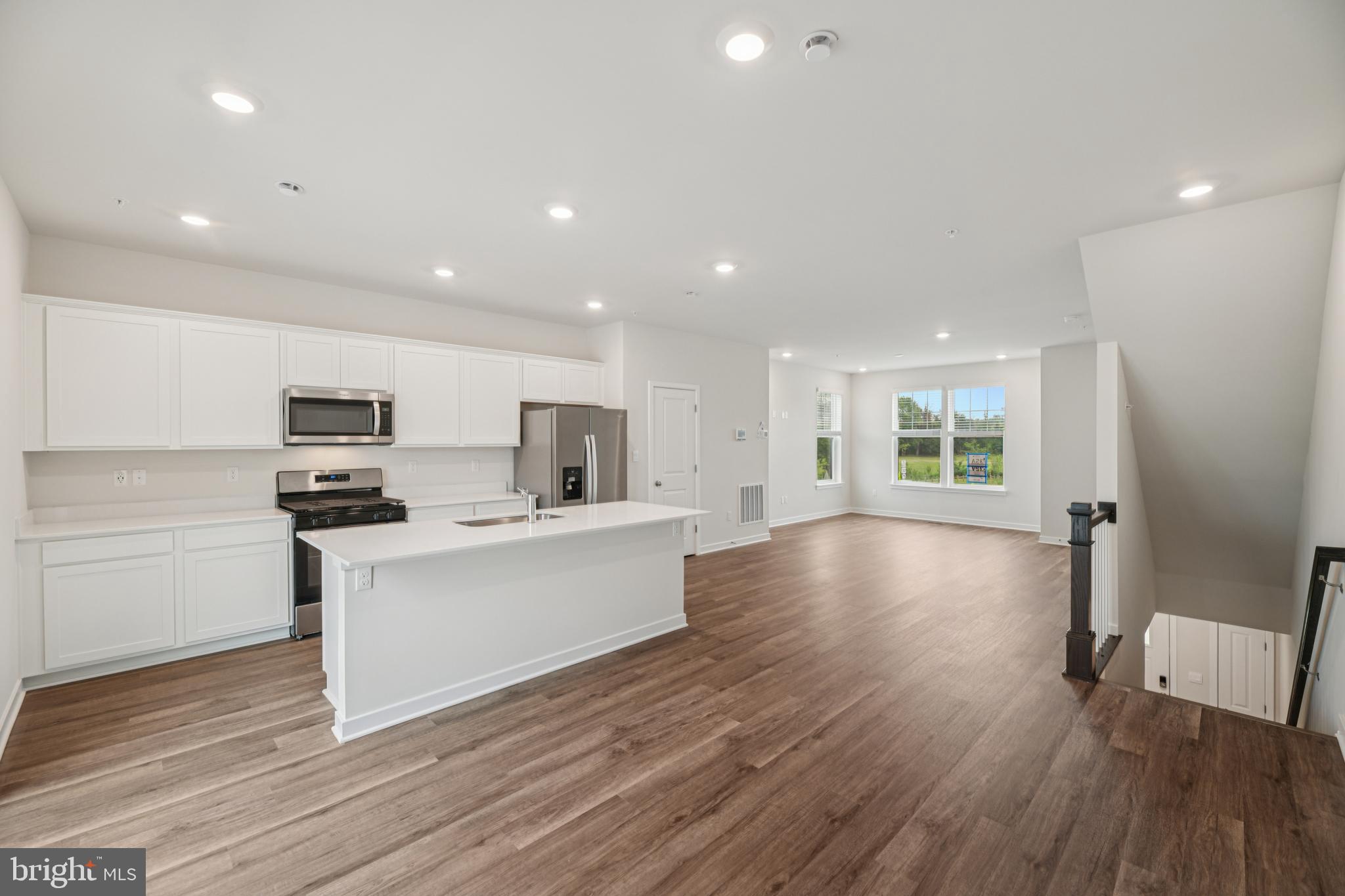 7406 Calm Retreat Boulevard Brandywine, MD 20613 - Photo 9 of 37 a view of kitchen with cabinets stainless steel appliances with wooden floor