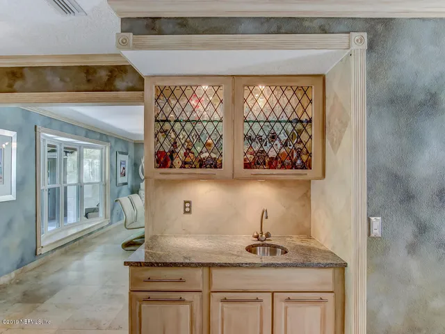 a kitchen with stainless steel appliances granite countertop a sink and cabinets