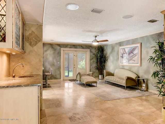a kitchen with a stove and cabinets