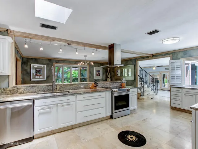 a view of a backyard with sitting area