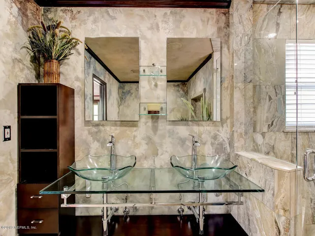 a view of a house with backyard porch and sitting area