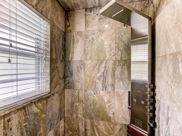 a view of a house with backyard and porch