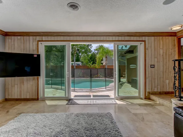 a view of walk in closet with clothes