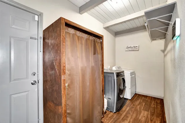 a view of a house with a yard and sitting area