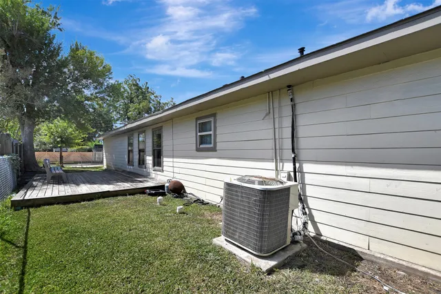 a front view of a house with a garden and yard