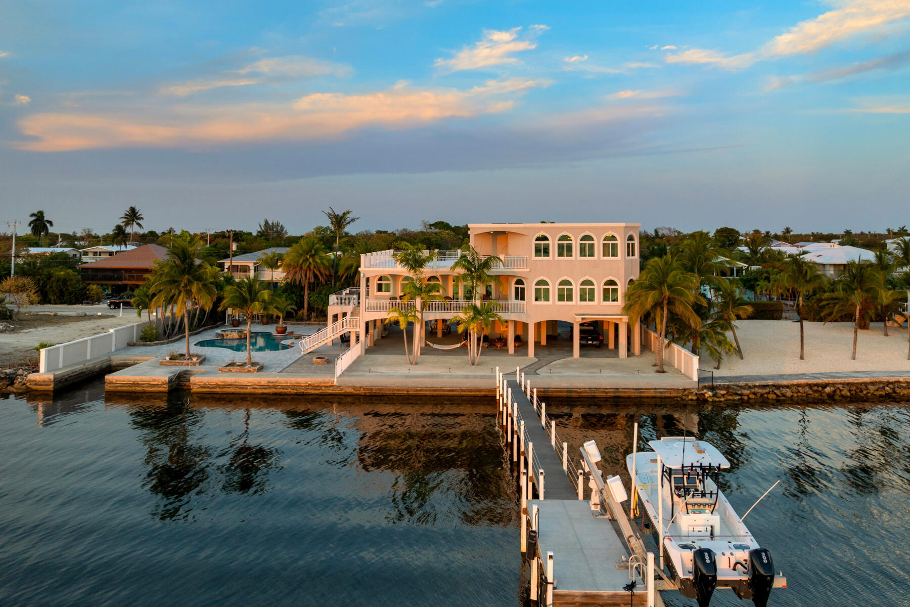 an aerial view of a house with lake view