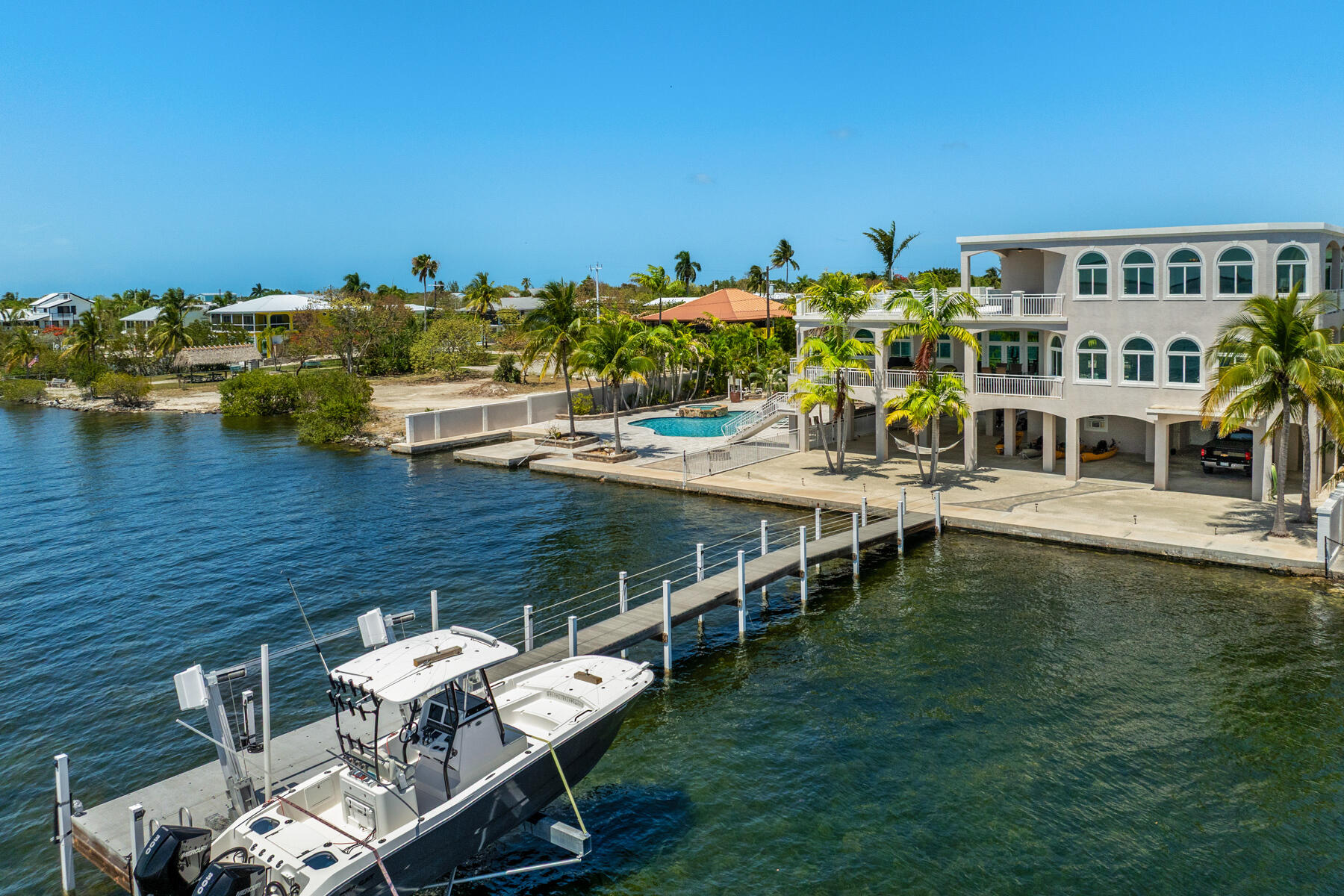 3742 Sea Grape Street Big Pine Key, FL 33043 - Photo 21 of 110 a terrace with outdoor seating and city view