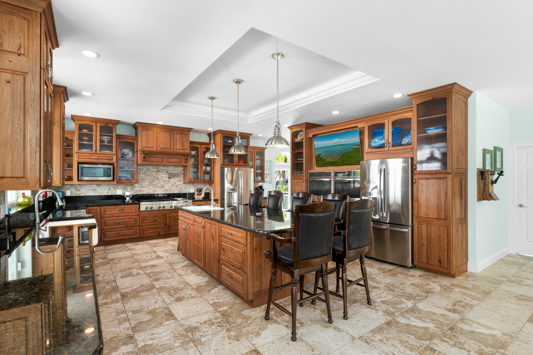 3742 Sea Grape Street Big Pine Key, FL 33043 - Photo 38 of 110 a kitchen with stainless steel appliances kitchen island granite countertop a refrigerator and a sink