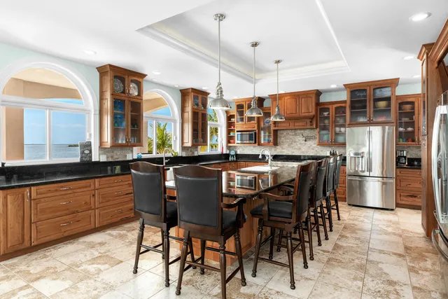 a dining room with furniture and a potted plant