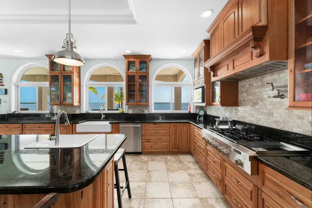 a view of a house with a backyard porch and sitting area