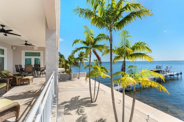 a view of swimming pool with a table and chair