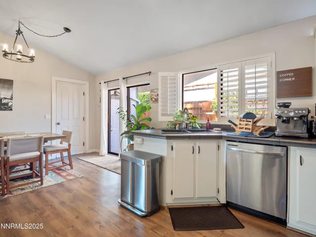 a kitchen with white cabinets and counter space