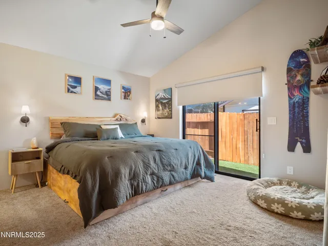 a spacious bedroom with a bed and a couch