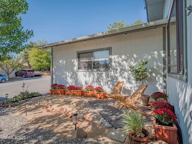 front view of a house with a backyard
