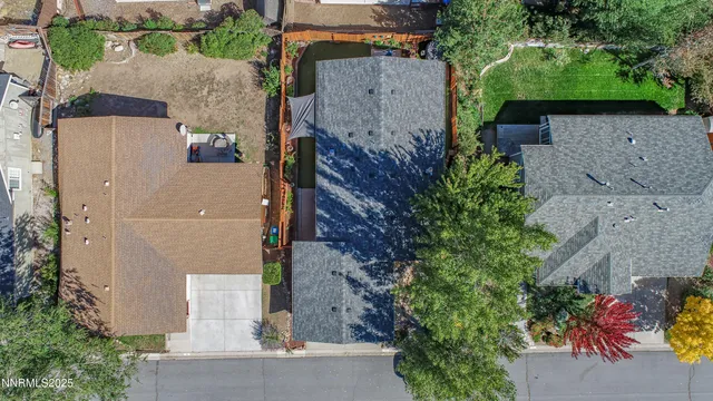 an aerial view of a house with outdoor space