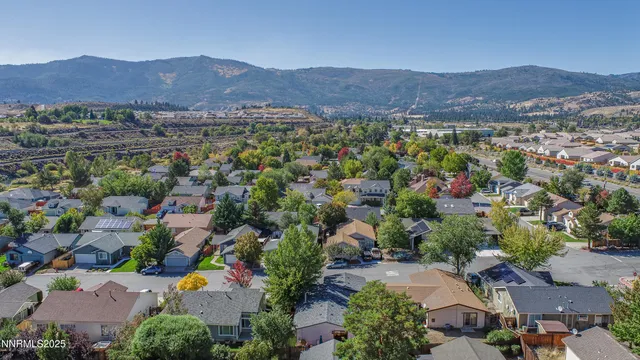 an aerial view of residential house and sandy dunes