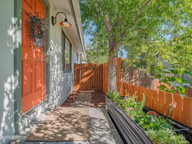 a backyard of a house with a garden