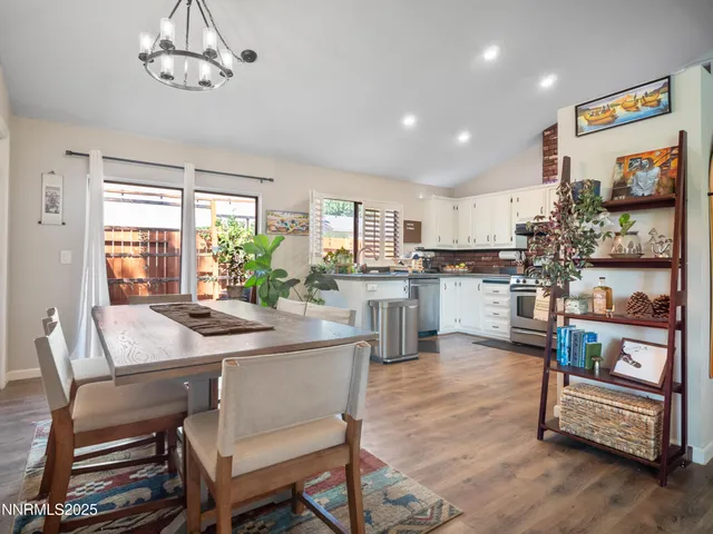 a dining table and chairs in a living room