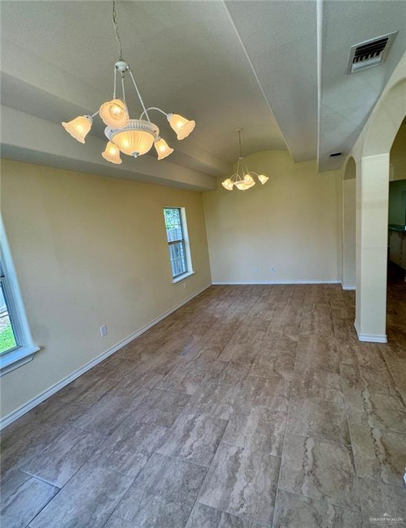 2207 Turtle Court Mission, TX 78572 - Photo 4 of 22 a view of empty room with window and chandelier
