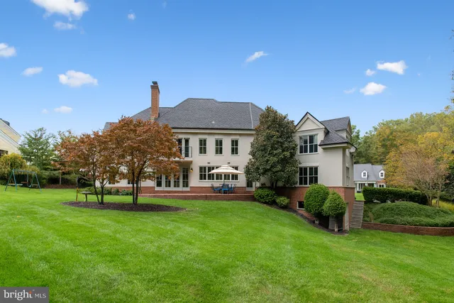a front view of a house with a yard porch and sitting area