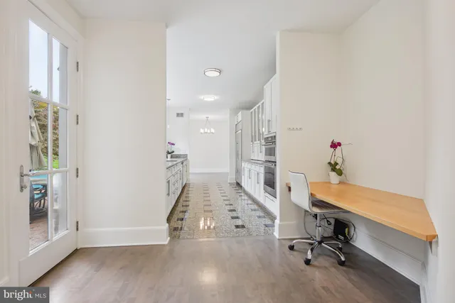 a view of entryway with livingroom and wooden floor