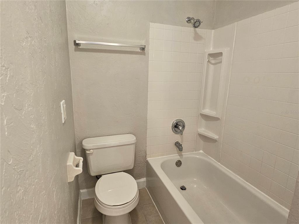 7000 Brentford Road Sarasota, FL 34241 - Photo 21 of 29 a white toilet sitting next to a bath tub