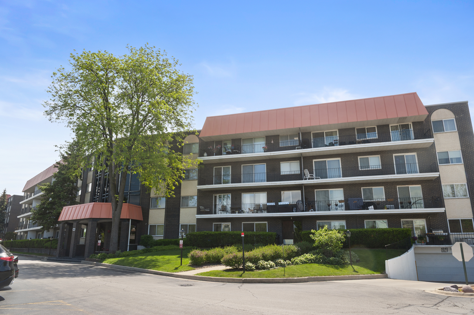 4949 Golf Road, Unit 101 Skokie, IL 60077 - Photo 22 of 22 a front view of a building with garden